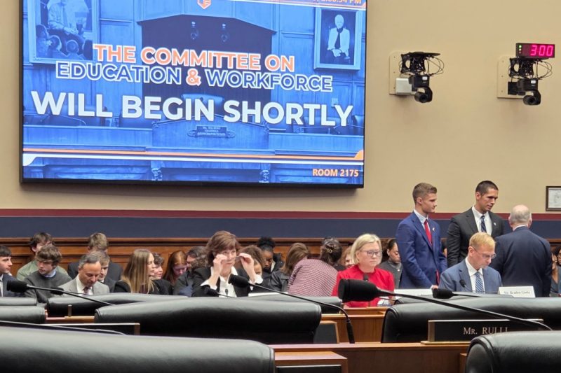 Virginia Cyber Range advisory board member Kristi Rice waits for a committee meeting to start.