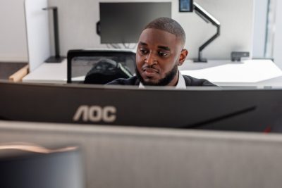 Kene Nwodo working at his computer. Craig Newcomb photo