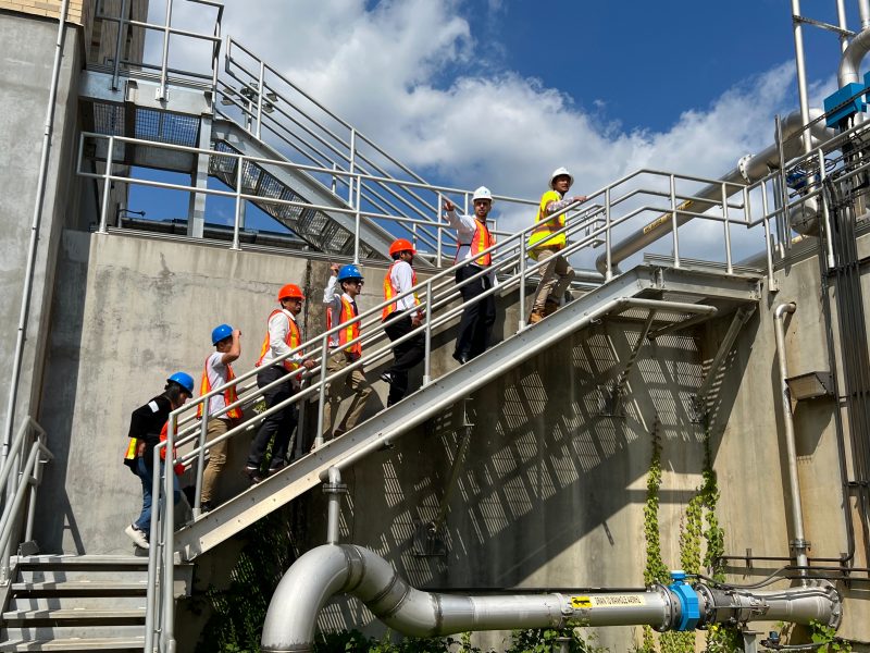 CCI/Virginia Tech researchers and grad students walk up the stairs at DC Water.