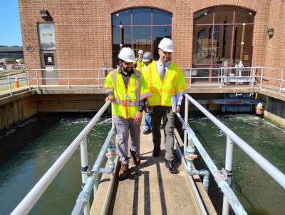 A group of people tour a water facility