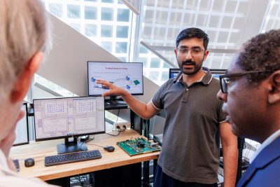 Graduate student demonstrates mobile distributed MIMO.
