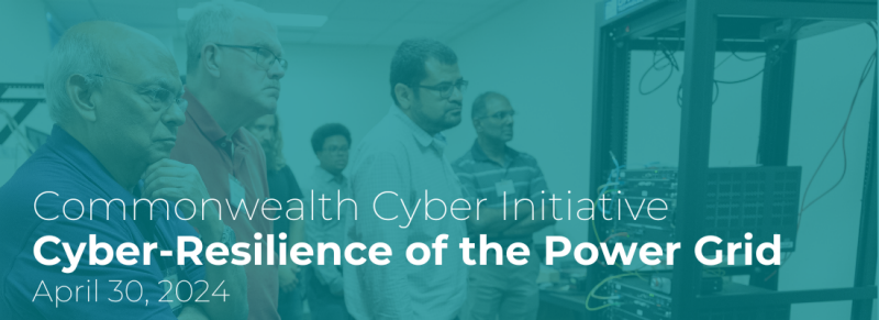 Group of faculty listening and standing to someone speak